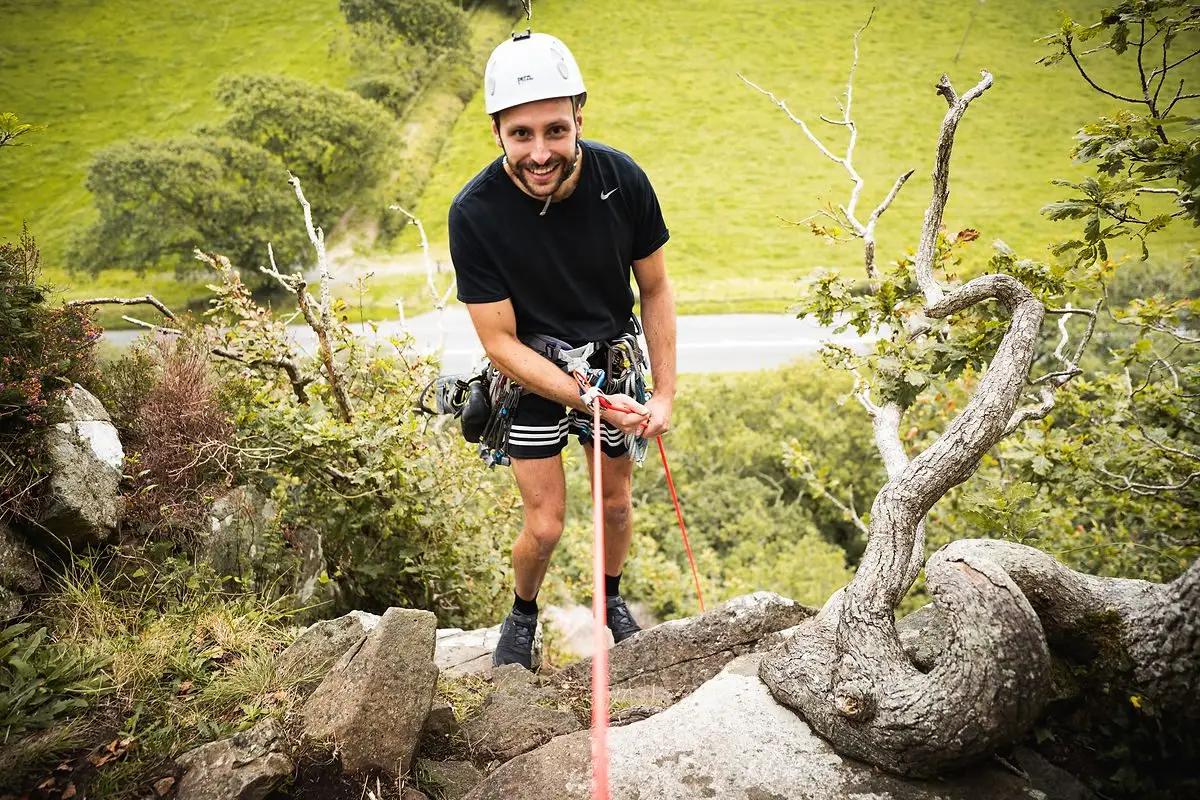 abseiling while climbing